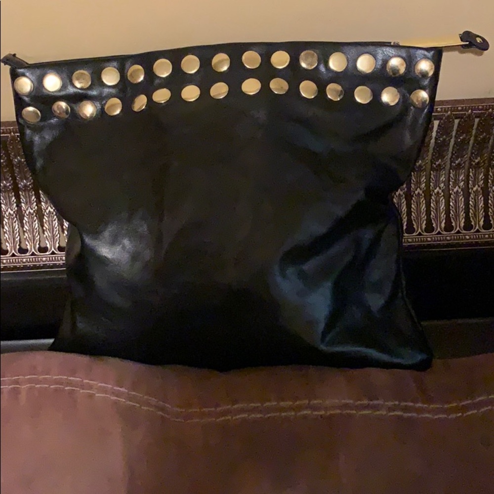A black Steve Madden purse with silver studs